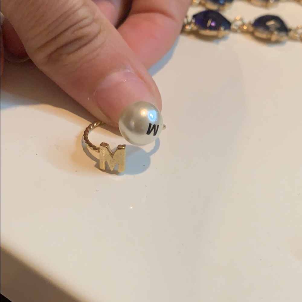 This is more a midi ring gold plated M initial